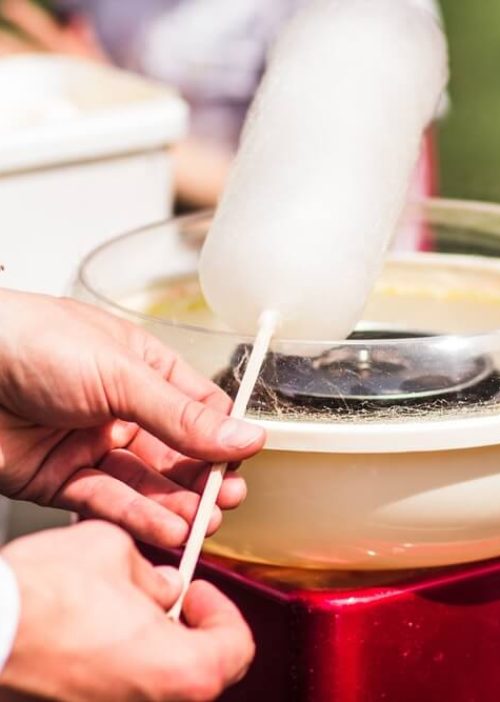 Man making a Cotton Candy in Machine